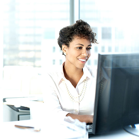 woman working at a desktop computer